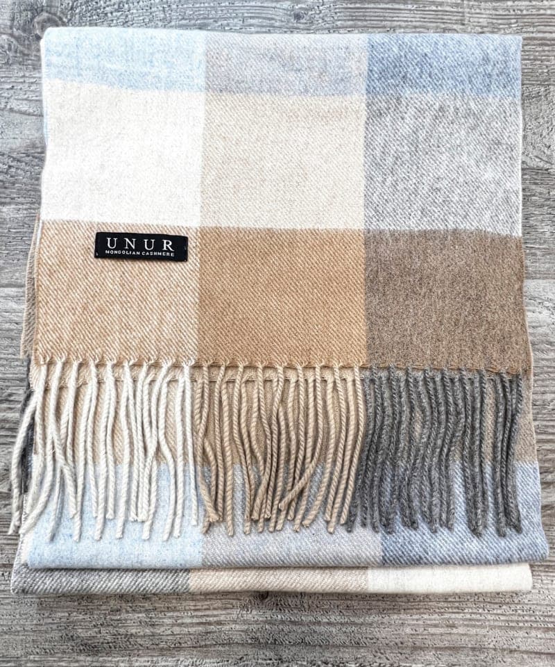 Lay-flat close up of check brown unisex woven cashmere scarf with tassles