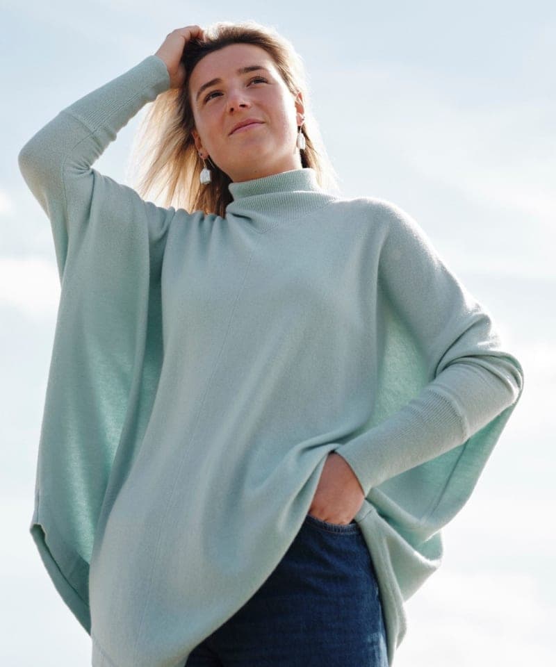 Women's mint green cashmere poncho on model